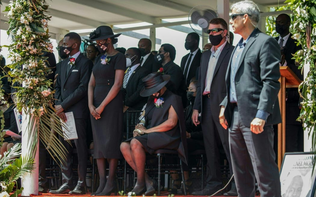 Slain Haitian President Jovenel Moïse's widow Martine sits amid family, during the tense disrupted funeral in Cap-Haitien.