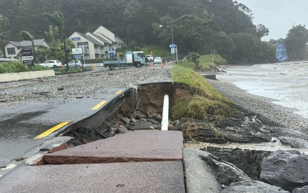Huge swells triggered by ex-Cyclone Tam washed away part of the waterfront in Paihia, exposing cables and a water main.