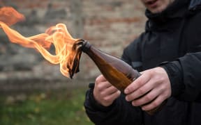 Man attack with molotov cocktail in public area