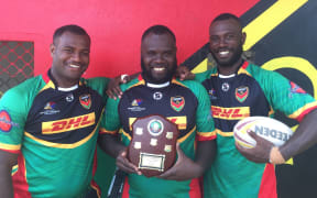Brothers and Vanuatu teammates Ben Lui (left), Tonny Lui (middle) and Danford Lui (right) with the Vanuatu and Solomon Islands Trophy.