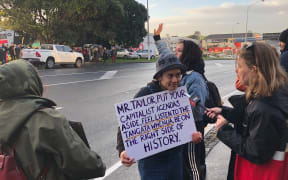 About 80 people protested outside Fletcher Building's Auckland headquarters this morning against the company's proposed development at Ihumātao.