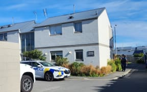 Police at the social housing complex on Innes Road in Mairehau.
