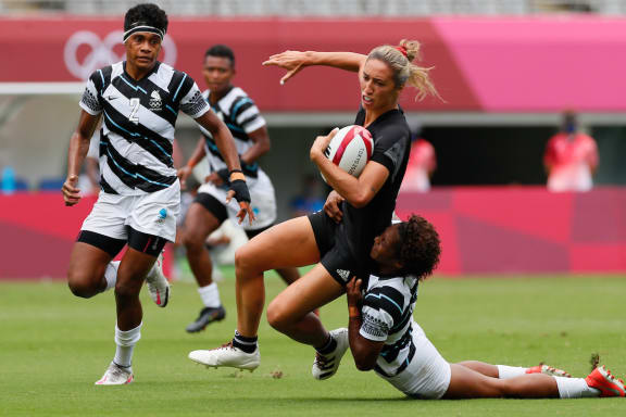 Black Fern Sarah Hirini with the ball, in the womens sevens semi-final against Fiji earlier today.