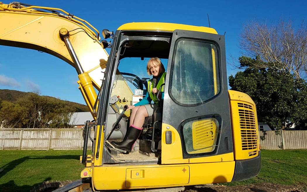 Social Housing Minister Amy Adams poses for photographs at the Seddon Street site in Naenae.