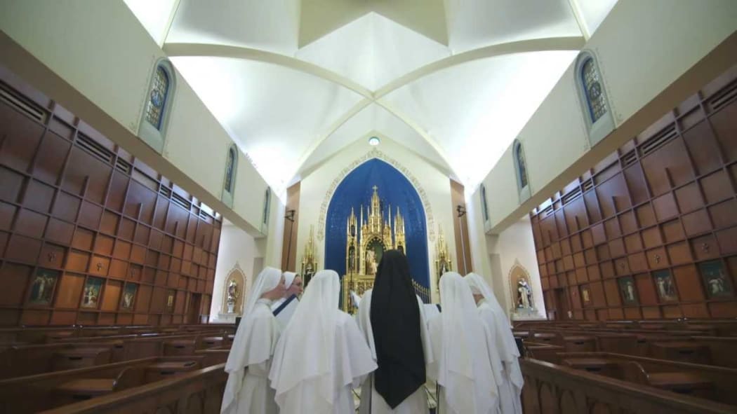 The nuns at the top of the billboards