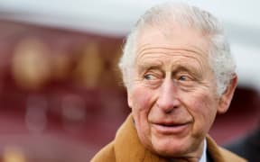 Britain's Prince Charles, Prince of Wales reacts upon his arrival to join his wife Britain's Camilla, Duchess of Cornwall (unseen) for a visit of the Medway Aircraft Preservation Society (MAPS) in Rochester, on February 2, 2022