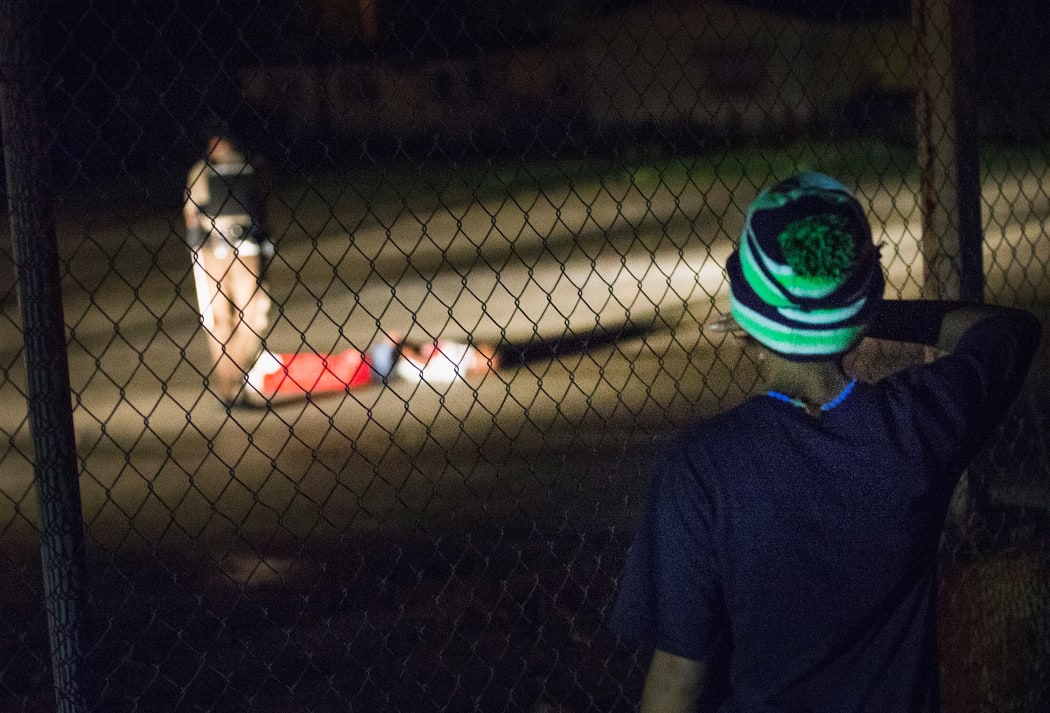 Tyrone Harris (pictured lying on ground) was critically wounded during the demonstration on Sunday.