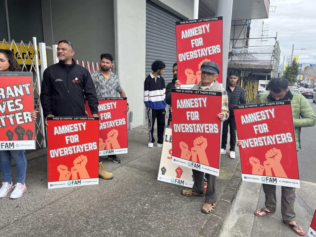 People protest over migrant worker exploitation outside Ethnic Communities Minister Priyanca Radhakrishnan's office in Auckland on Saturday.