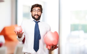 Man holding piggy banks
