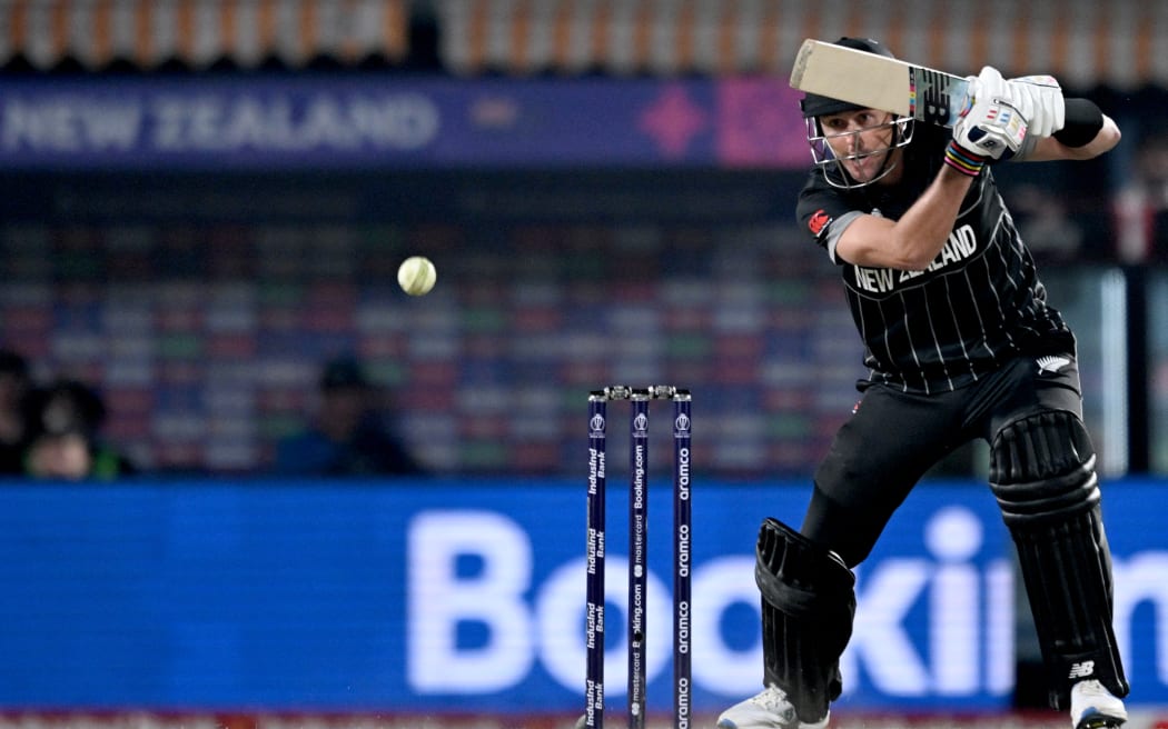 New Zealand's James Neesham plays a shot during the 2023 ICC Men's Cricket World Cup one-day international (ODI) match between Australia and New Zealand at the Himachal Pradesh Cricket Association Stadium in Dharamsala on October 28, 2023. (Photo by Money SHARMA / AFP) / -- IMAGE RESTRICTED TO EDITORIAL USE - STRICTLY NO COMMERCIAL USE --