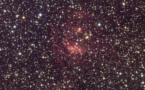 A handout image released on June 23, 2026 by the European Space Agency and taken on March 23, 2025 for a period of 26 hours by the Euclid’s optical camera VIS to wich  the colours were added using observations captured in the summer of 2025 with the Canada-France-Hawaii Telescope’s MegaCam camera (CFHT-Megacam) in Hawaii shows our Milky Way galaxy’s centre. 60 million stars, billions of visible galaxies and image quality never seen before: on June 24, 2026, the European Space Agency (ESA) unveiled the centre of the Milky Way, which should enable the identification of new exoplanets. (Photo by Handout / EUROPEAN SPACE AGENCY / AFP) / RESTRICTED TO EDITORIAL USE - MANDATORY CREDIT "AFP PHOTO /  HANDOUT  / EUROPEAN SPACE AGENCY" - HANDOUT - NO MARKETING NO ADVERTISING CAMPAIGNS - DISTRIBUTED AS A SERVICE TO CLIENTS