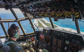 A Royal New Zealand Air Force pilot in the cockpit of an plane
