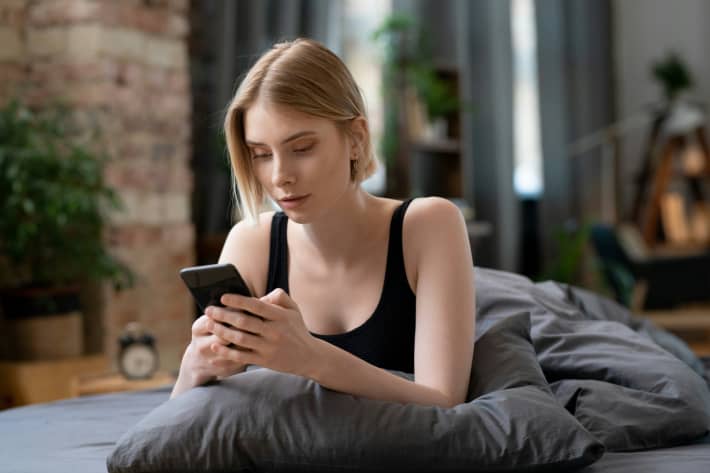 Woman on a cellphone cancelling plans.