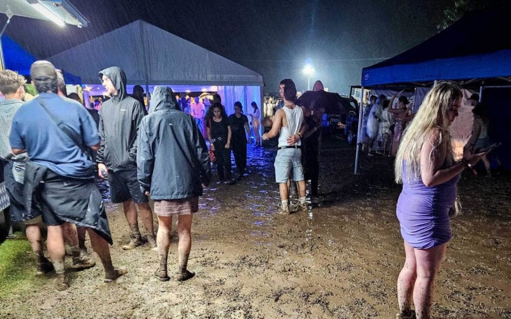 New Year's Eve festival-goers faced mud at the Highlife Festival at Ascension Wine Estate in Matakana.