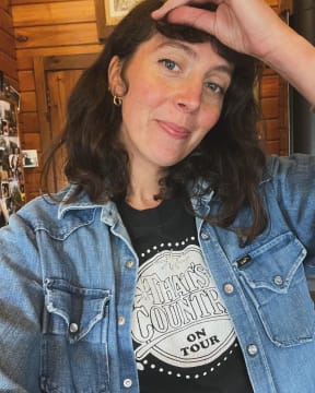 New Zealand singer-songwriter Amiria Grenell wearing a t-shirt and denim jacket which belonged to her father John Grenell.