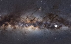 This image shows the Milky Way as viewed from Earth. The star icon shows the position of the mysterious object astronomers have discovered.