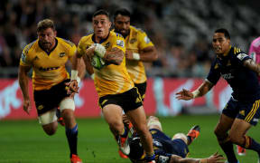 TJ Perenara of the Hurricanes makes a break.