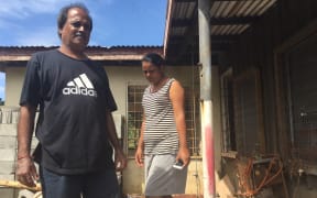 Sanjay and Ranjana pick through the mess after they survived flooding in Fiji’s Ba area.