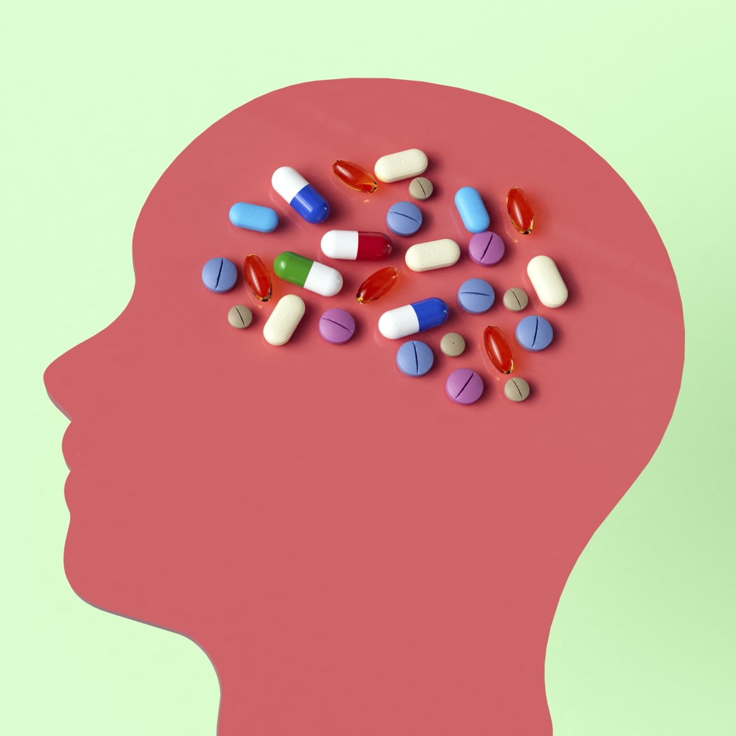 Conceptual illustration showing drugs that target the human brain to treat neurological disorders.