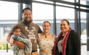 Michael Moka and his wife Tōria with their son Raukura O Te Huia, with the scholar they are supporting through First Foundation, Ella Harre.