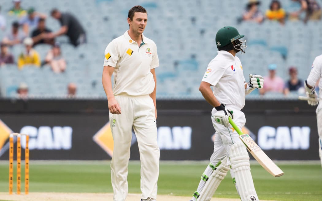Australian bowler Josh Hazlewood has words with Azhar Ali of Pakistan.