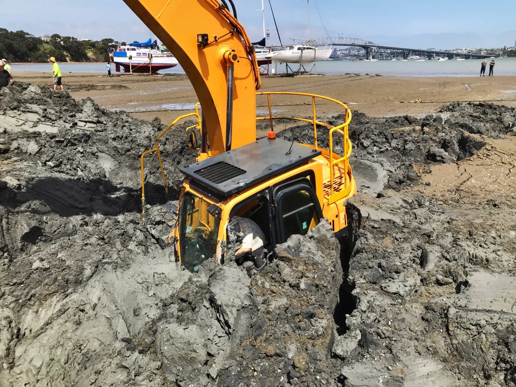 The digger becomes submerged up to its arm at high tide.