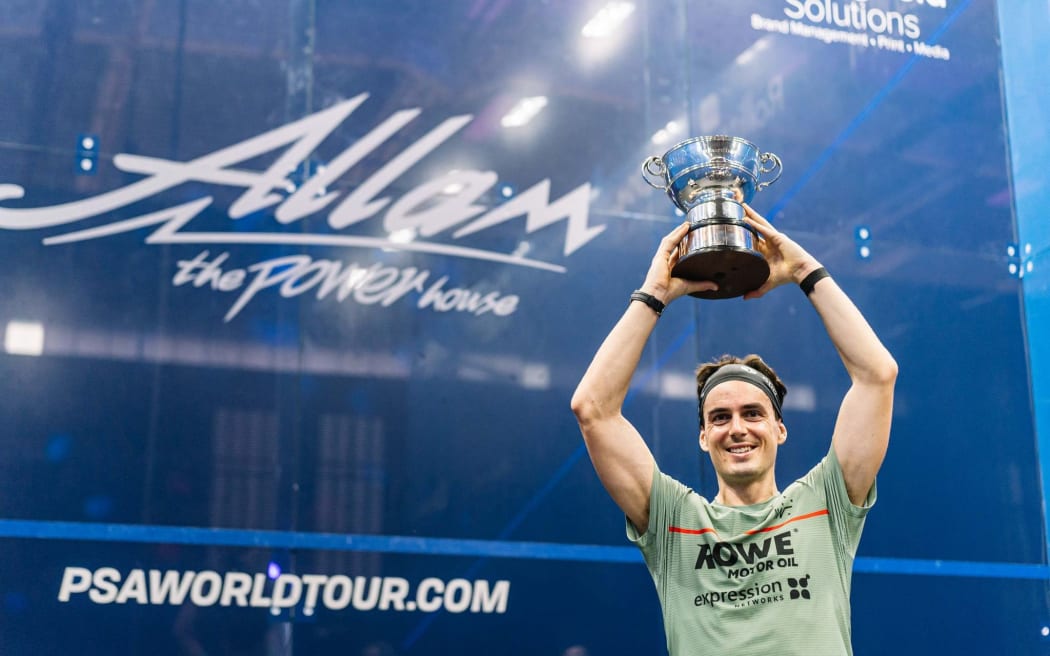 Paul Coll lifts the British Open trophy in Hull after beating Egypt's Ali Farag 6-11, 11-6, 11-6, 11-8 in the final.