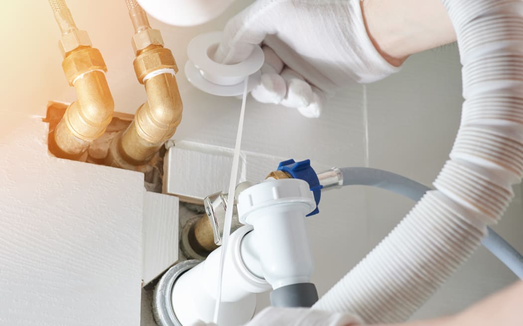 Fixing plumbing system in bathroom close up view