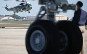 JOINT BASE ANDREWS, MARYLAND - OCTOBER 05: Marine One carrying U.S. President Donald Trump lands at Joint Base Andrews en route to Naval Station Norfolk to visit the USS George H.W. Bush aircraft carrier on October 5, 2025 at Joint Base Andrews, Maryland. President Trump is visiting Naval Station Norfolk in Virginia for a celebration of the 250th birthday of the U.S. Navy.   Alex Wong/Getty Images/AFP (Photo by ALEX WONG / GETTY IMAGES NORTH AMERICA / Getty Images via AFP)