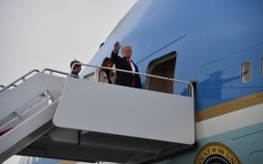 US President Donald Trump boards Air Force One in West Palm Beach, Florida with First Lady Melania Trump and son Barron Trump en route to Washington.