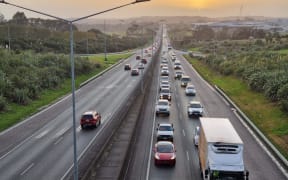 Traffic crawling towards the city passing Whenuapai as a Budget Day protest 'carkoi' set off on 30 May 2024.