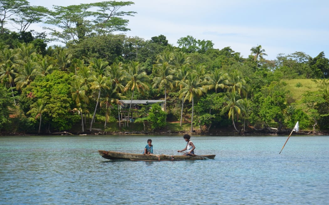 Manus Island locals in a canoe off the south coast. From here the only way to Lorengau is a two hour speed boat ride.