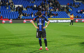 Auckland FC's Hiroki Sakai dejected after their semi-final loss to the Melbourne Victory.