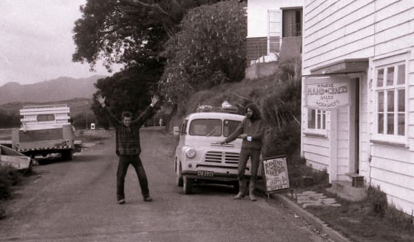 Louis "Puzzleman" Toorenburg (right) in 1975 outside the Rāwene puzzle shop he's still running 50 years later.