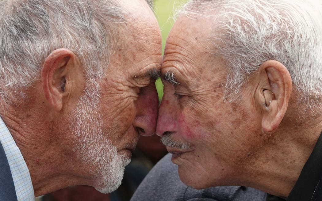 Malaya vet Peter Pangari, of Dargaville, shares a hongi with Tā (Sir) Robert “Bom” Gillies, last surviving member of the 28th Māori Battalion.