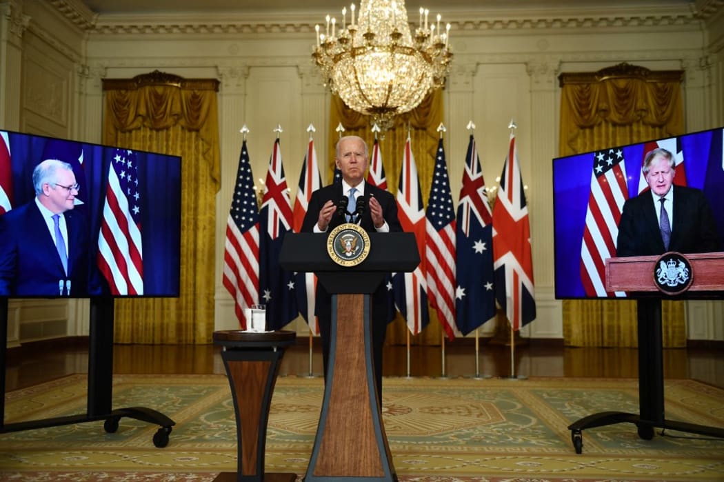 US President Joe Biden participates is a virtual press conference on national security with British Prime Minister Boris Johnson (R) and Australian Prime Minister Scott Morrison in the East Room of the White House in Washington, DC, on September 15, 2021.