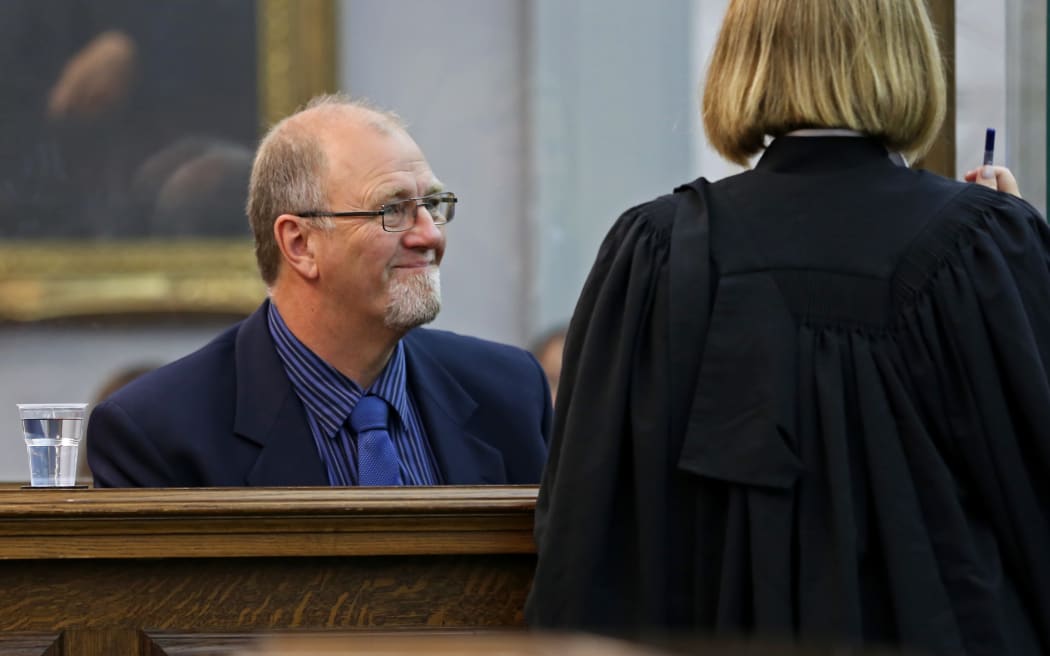 Mark Lundy talking to one of his lawyers.