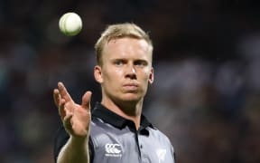 New Zealand's Scott Kuggeleijn catches the ball during the third Twenty20 international cricket match between New Zealand and India in Hamilton on February 10, 2019.