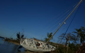 Yacht thrown up on the shore near Port Vila, Vanuatu after Cyclone Pam, March 2015