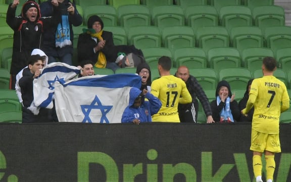 Tomer Hemed of the Phoenix celebrates a goal with Israeli supporters, 2021.