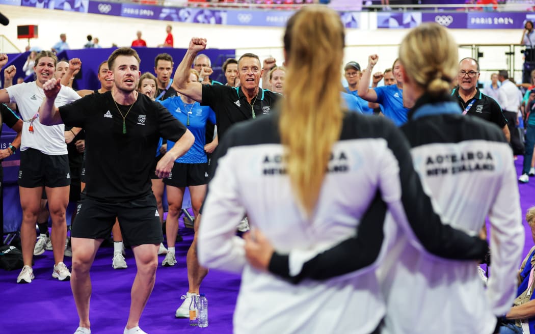 Picture by Ed Sykes/SWpix.com - 11/08/2024 -  Paris 2024 Olympic Games - Track Cycling - National Velodrome, Saint-Quentin-en-Yvelines, France - Members of the New Zealand Cycling Team performing the Haka after Ally Wollaston (New Zealand) won the Olympic Bronze Medal in the Women's Omnium and Ellesse Andrews (New Zealand) won the Olympic Gold Medal in the Women's Sprint