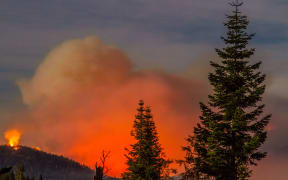 USA, Kings Canyon: The so-called Rough wildfire — which had spread over 95,000 acres in the Sierra Nevada mountains by September 8, 2015 — is photographed as it burns through Kings Canyon National Park in California on August 28