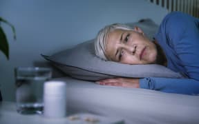 Sleep disorder. Worried senior woman with insomnia. (Photo by MICROGEN IMAGES/SCIENCE PHOTO LI / SMD / Science Photo Library via AFP)