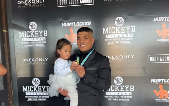 Duken Tutakitoa-Williams, Boxer holding his daughter who is wearing a white tutu.
