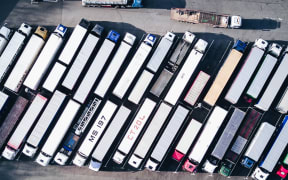 Truck and trailer units parked.