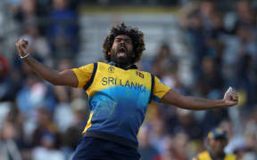 Lasith Malinga celebrates dismissing England's Jos Buttler in the world cup match at Leeds.