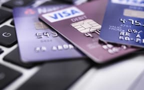 Credit card on laptop illustrating online shopping and banking.