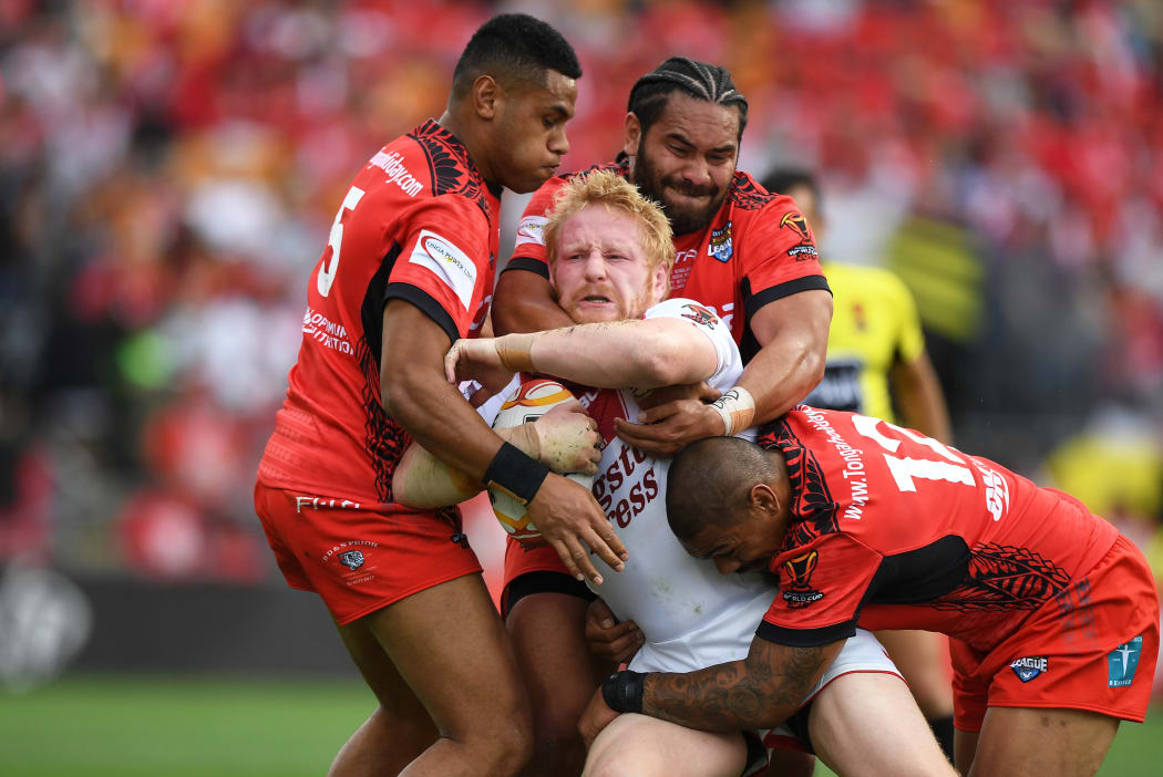 England's James Graham wrapped up by Tonga