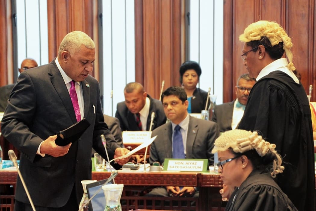 Fiji's Prime Minister, Frank Bainimarama, taking the oath of office at the first sitting of the country's parliament