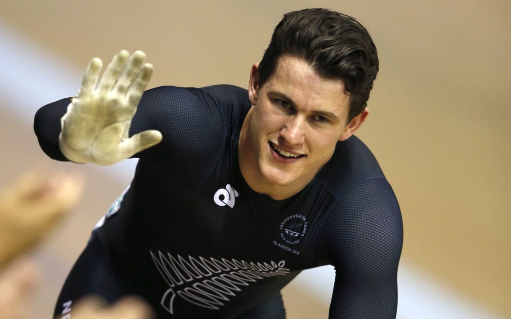 Sam Webster celebrates winning the gold medal in the men's sprint final in the Sir Chris Hoy Velodrome in Glasgow.